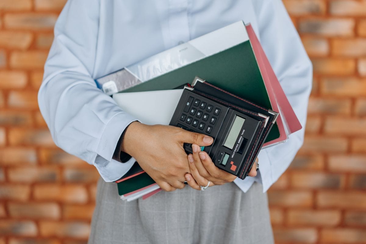 Bookkeeper reviewing financial records on a laptop