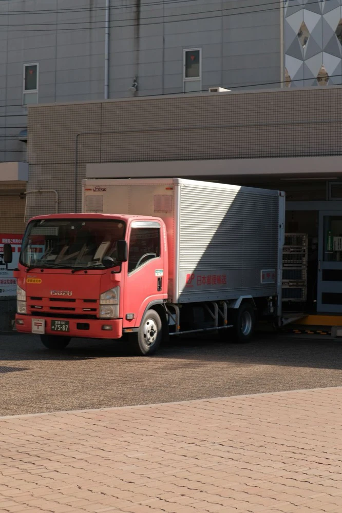 Refrigerated delivery vehicle being loaded with catch weight food orders for a route