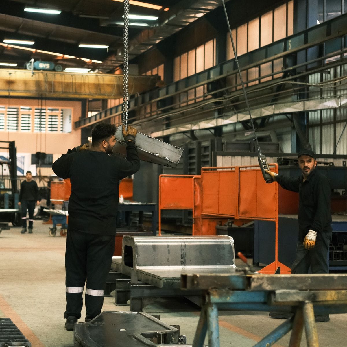 Machinist running a job at a work centre in a manufacturing workshop