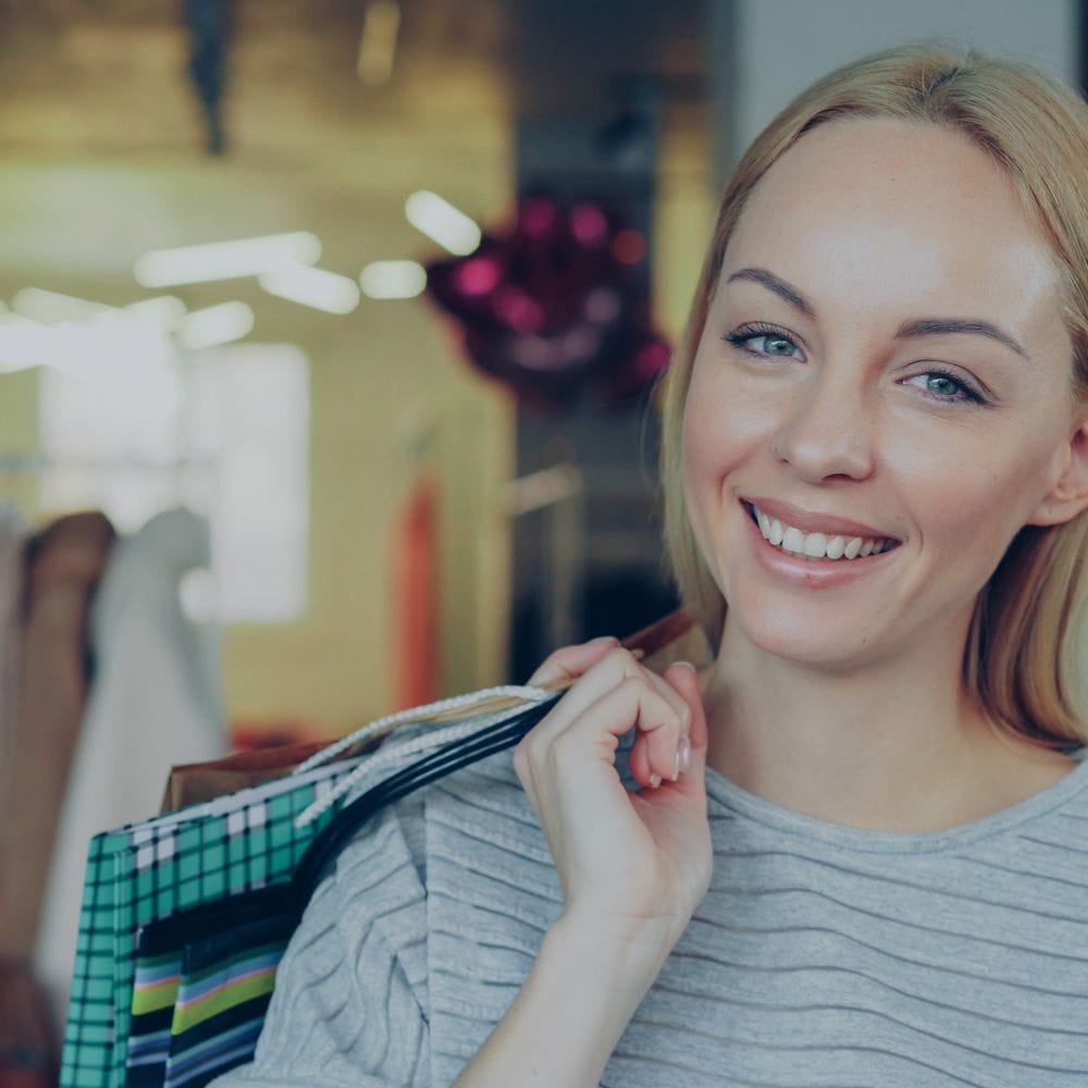 Shop staff serving a customer at the counter