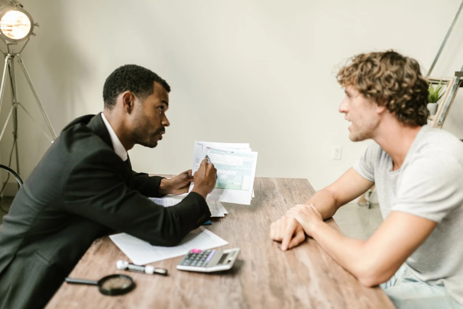 Advisor reviewing documents with a client in an ongoing support discussion