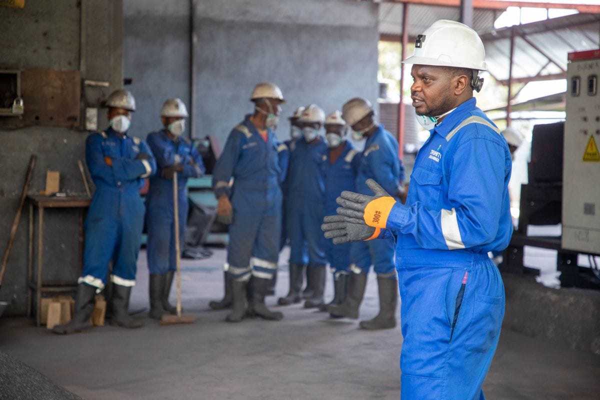 Supervisor walking the production crew through the new process after go-live