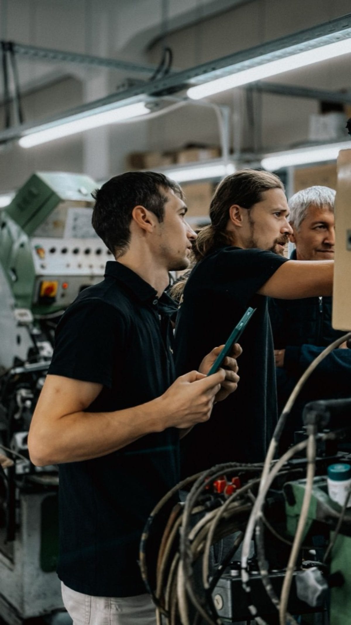 Supervisor and operators agreeing the next works order at the machine before it runs