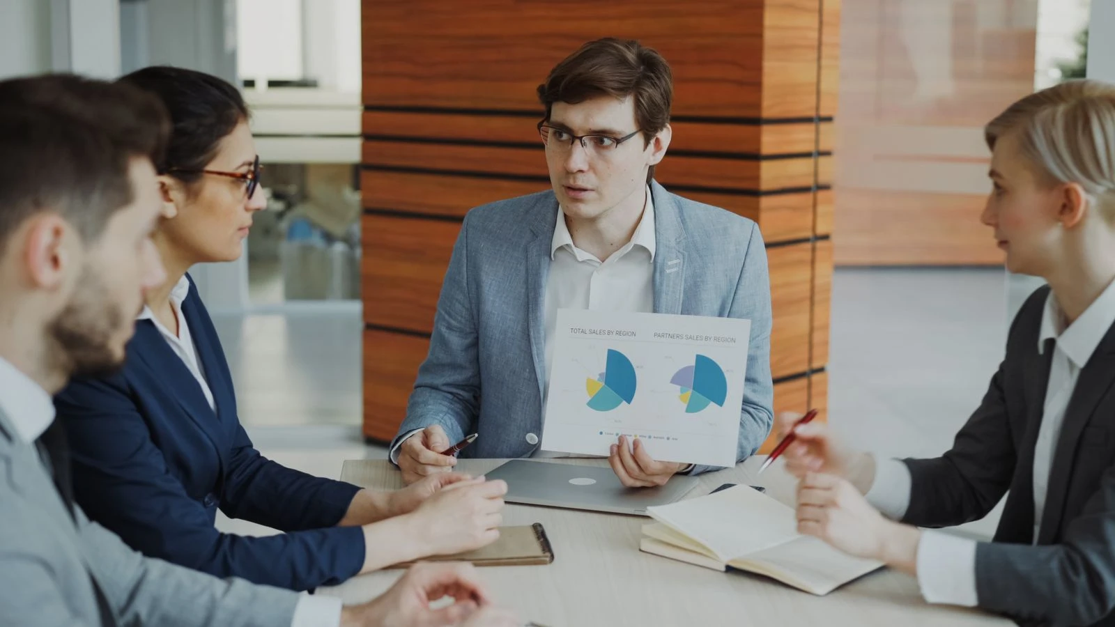 Presenter comparing candidate-system data with the team during ERP selection