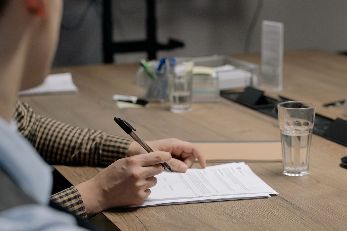 Customer signing a rental agreement contract