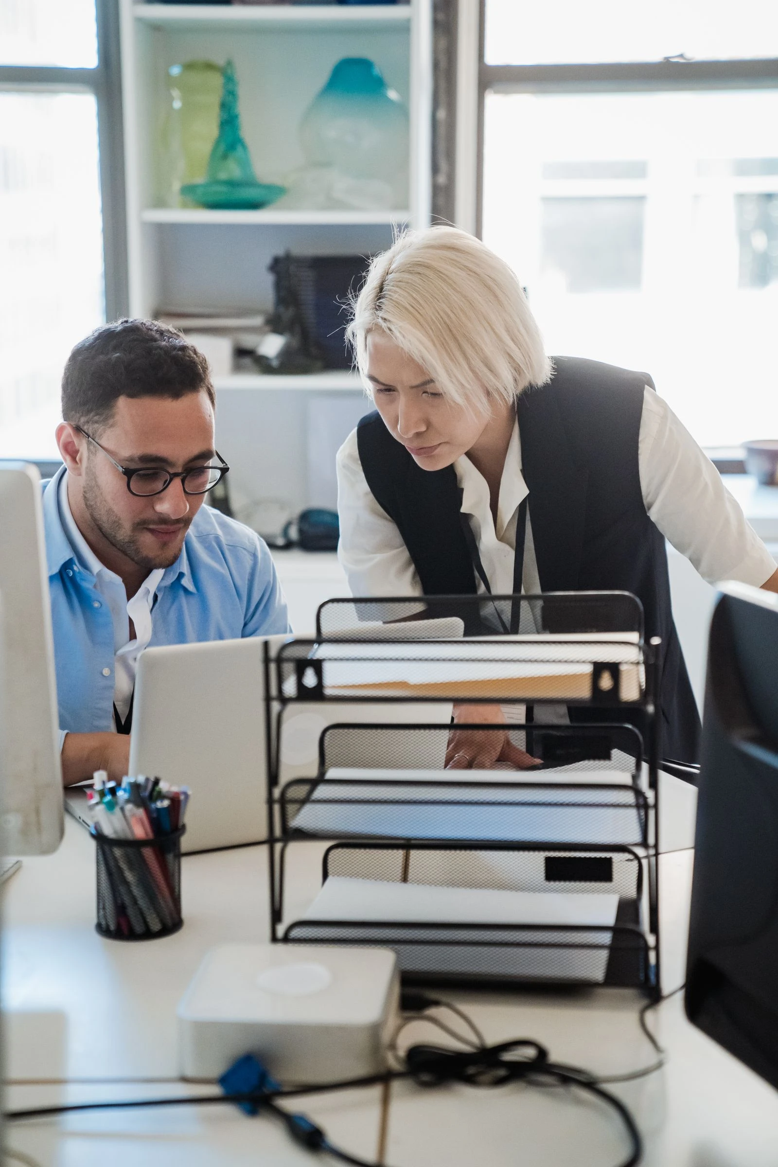 Index World accountants reviewing a client's QuickBooks file together