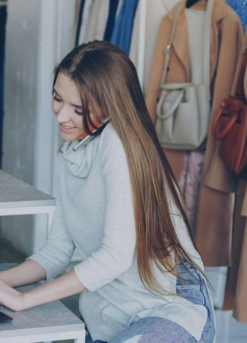 Retail manager checking stock and daily takings on one connected system
